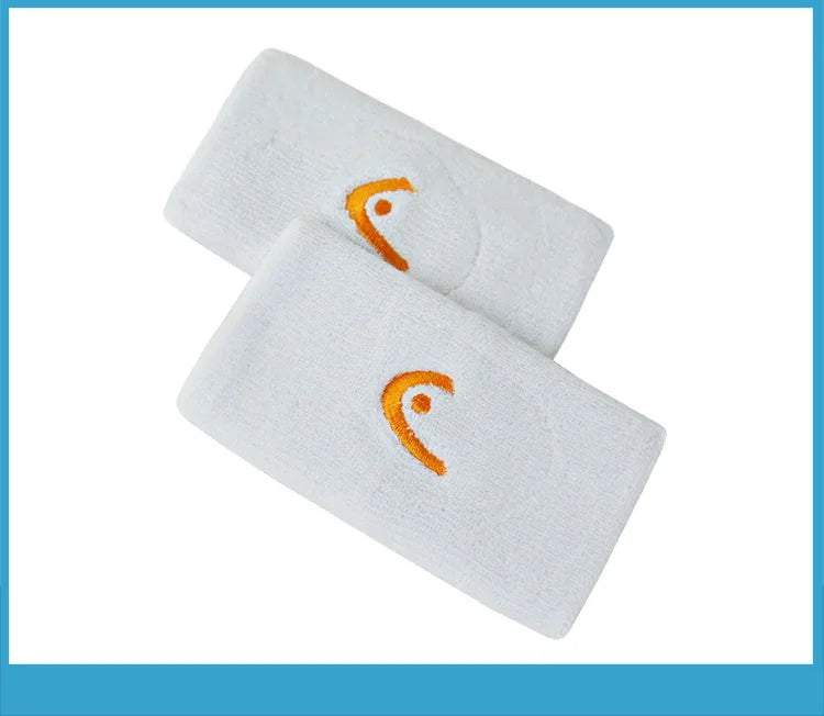 Deux Bracelets Absorbants de Sport HEAD™ blanc avec logo orange 5 pouces.